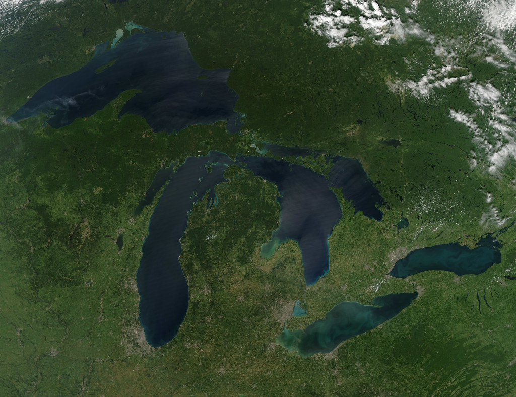 NASA image acquired August 28, 2010 Late August 2010 provided a rare satellite view of a cloudless summer day over the entire Great Lakes region. North Americans trying to sneak in a Labor Day weekend getaway on the lakes were hoping for more of the same. The Great Lakes comprise the largest collective body of fresh water on the planet, containing roughly 18 percent of Earth's supply. Only the polar ice caps contain more fresh water. The region around the Great Lakes basin is home to more than 10 percent of the population of the United States and 25 percent of the population of Canada. Many of those people have tried to escape record heat this summer by visiting the lakes. What they found, according to The Hamilton Spectator, was record-breaking water temperatures fueled by record-breaking air temperatures in the spring and summer. By mid-August, the waters of Lake Superior were 6 to 8°C (11 to 14°F) above normal. Lake Michigan set records at about 4°C (7°F) above normal. The other three Great Lakes – Huron, Erie, and Ontario -- were above normal temperatures, though no records were set. The image was gathered by the Moderate Resolution Imaging Spectroradiometer (MODIS) on NASA’s Aqua satellite at 1:30 p.m. Central Daylight Time (18:30 UTC) on August 28. Open water appears blue or nearly black. The pale blue and green swirls near the coasts are likely caused by algae or phytoplankton blooms, or by calcium carbonate (chalk) from the lake floor. The sweltering summer temperatures have produced an unprecedented bloom of toxic blue-green algae in western Lake Erie, according to the Cleveland Plain Dealer. . References . Environmental Protection Agency. (n.d.) The Great Lakes Atlas. Accessed September 3, 2010. . The Cleveland Plain Dealer. (August 22, 2010) Scientists say the toxic blue-green algae will only get worse on Ohio lakes. Accessed September 3, 2010. . The Hamilton Spectator. (August 13, 2010) Great Lakes turn to 'bath water.' Accessed September 3, 2010. NASA image by Jeff Schmaltz, MODIS Rapid Response Team, Goddard Space Flight Center. Caption by Mike Carlowicz. Instrument:  Aqua - MODIS Click here to see more images from NASA Goddard’s Earth Observatory NASA Goddard Space Flight Center is home to the nation's largest organization of combined scientists, engineers and technologists that build spacecraft, instruments and new technology to study the Earth, the sun, our solar system, and the universe. Follow us on Twitter Join us on Facebook