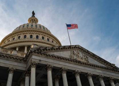 Washington DC. National Capitol building with US flag. US Government.
