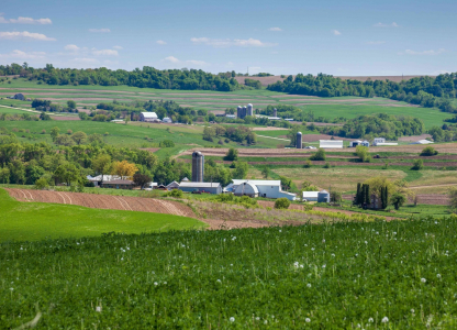 Farms,And,Fields,On,Rolling,Hills,In,The,Iowa,Countryside Farms and fields on rolling hills in the Iowa countryside during spring